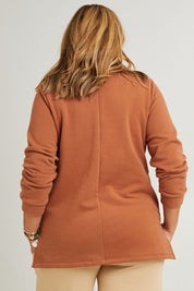 Model Fiona wearing the Cotton Fleece V Neck Sweater in colour Toffee, from the back