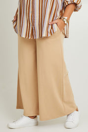 Model Fiona wearing the Cotton Terry Wide Leg Track Pants in colour Porridge, from the front, cropped image