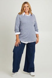 Model Fiona wearing the Raglan Sleeve Pullover in colour Indigo (Blue), from the front, showing the whole outfit