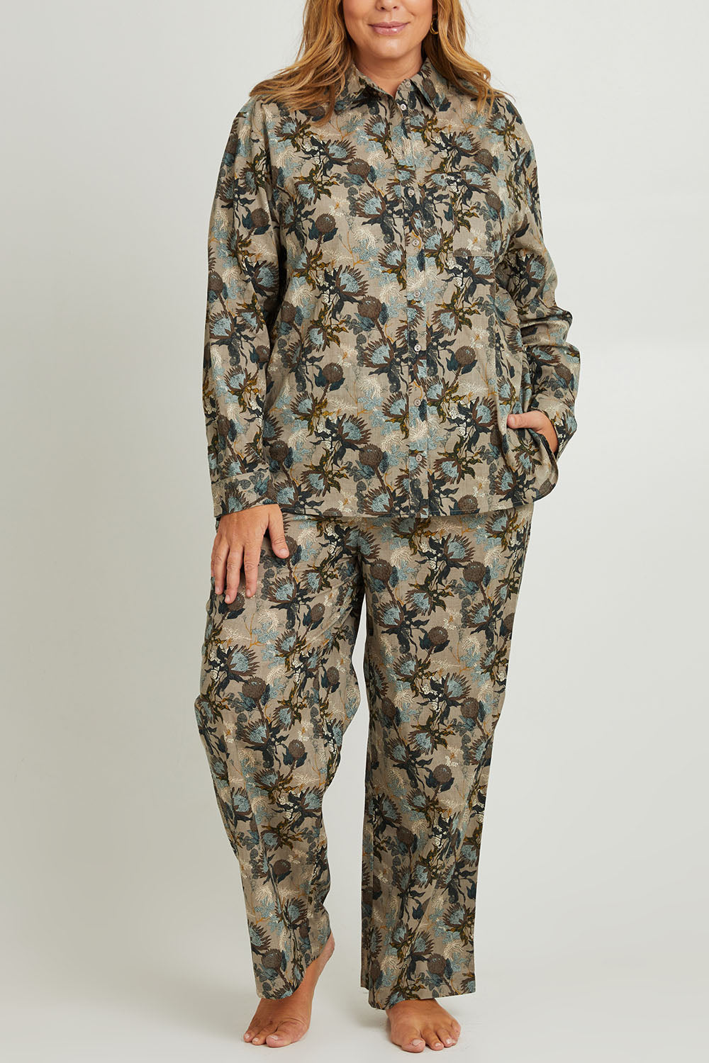 Model Fiona wearing the Cotton Long Sleeve Pyjama Set in colour Protea (Green), from the front, cropped image