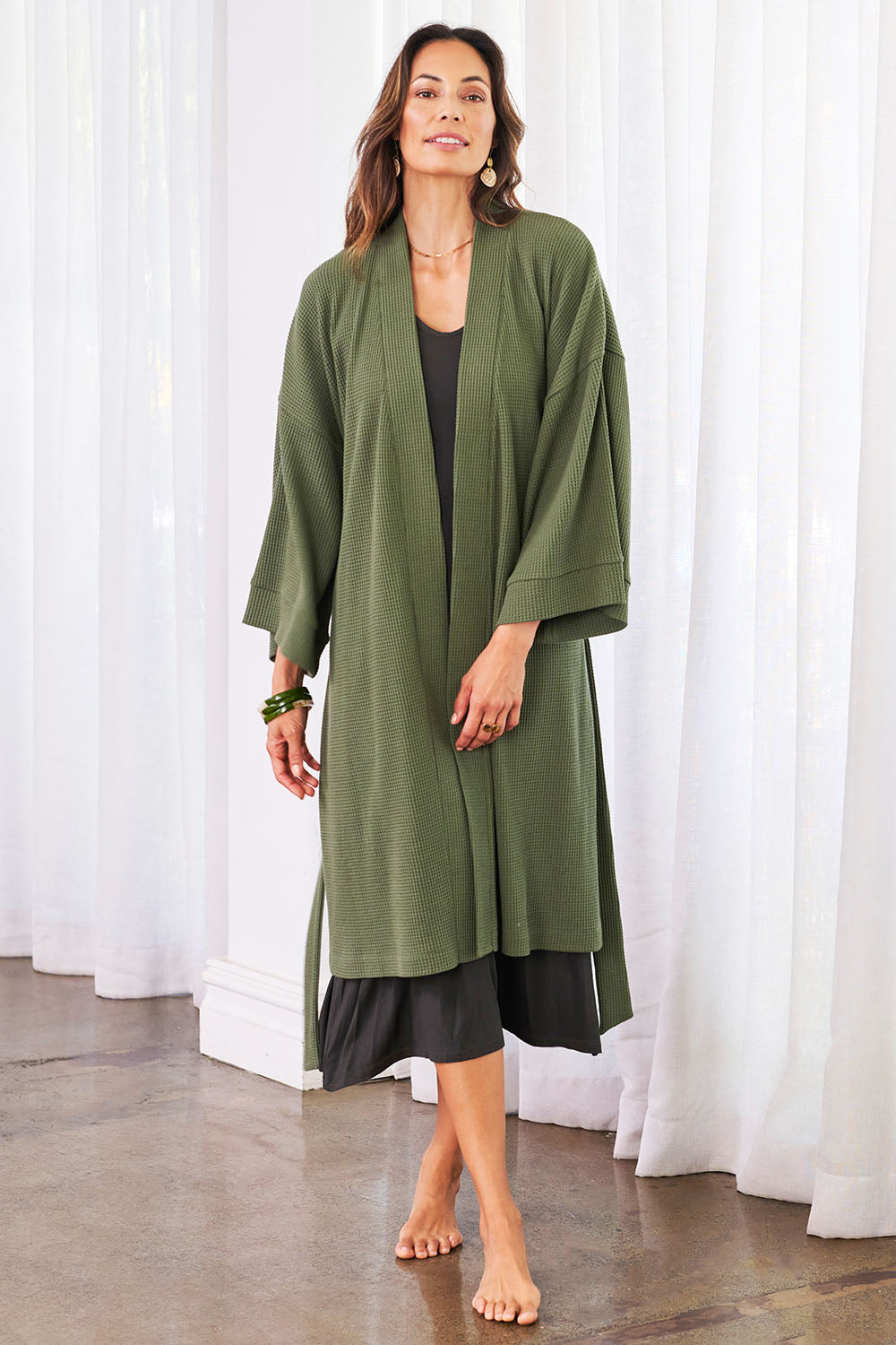 Model Amanda wearing the Cotton Waffle Dressing Robe in colour Norigreen (Green), from the front, showing the whole outfit