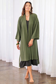 Model Amanda wearing the Cotton Waffle Dressing Robe in colour Norigreen (Green), from the front, showing the whole outfit
