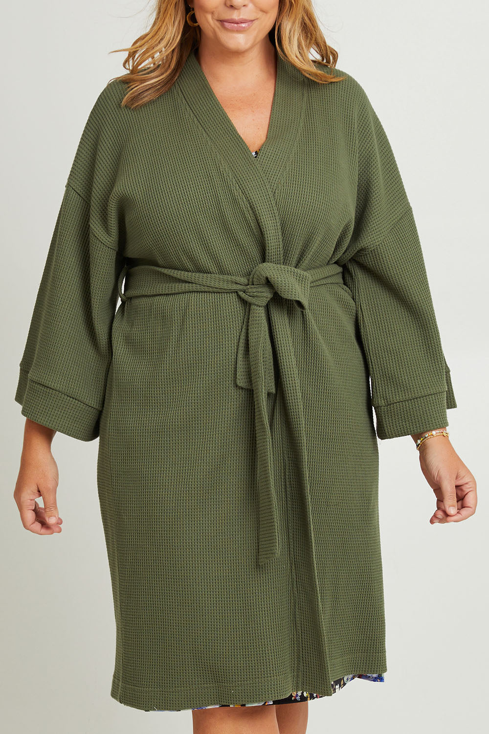 Model Fiona wearing the Cotton Waffle Dressing Robe in colour Norigreen (Green), from the front, cropped image
