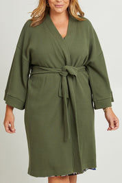 Model Fiona wearing the Cotton Waffle Dressing Robe in colour Norigreen (Green), from the front, cropped image