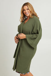 Model Fiona wearing the Cotton Waffle Dressing Robe in colour Norigreen (Green), from the front, cropped image