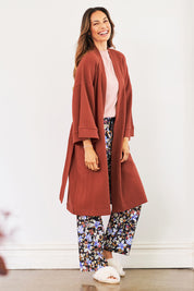 Model Amanda wearing the Cotton Waffle Dressing Robe in colour Rhubarb (Red), from the front, showing the whole outfit