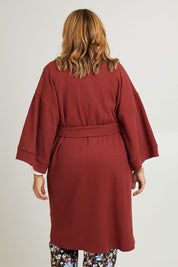 Model Fiona wearing the Cotton Waffle Dressing Robe in colour Rhubarb (Red), from the back