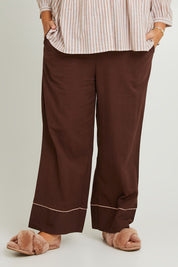Model Fiona wearing the Cotton Full Length Pyjama Pants in colour Chocolate, from the front, cropped image
