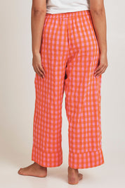 Model Terri-Leigh wearing the Cotton Check Pyjama Pants in colour Bright (Pink), from the back
