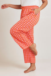 Model Terri-Leigh wearing the Cotton Check Pyjama Pants in colour Bright (Pink), from the front, cropped image