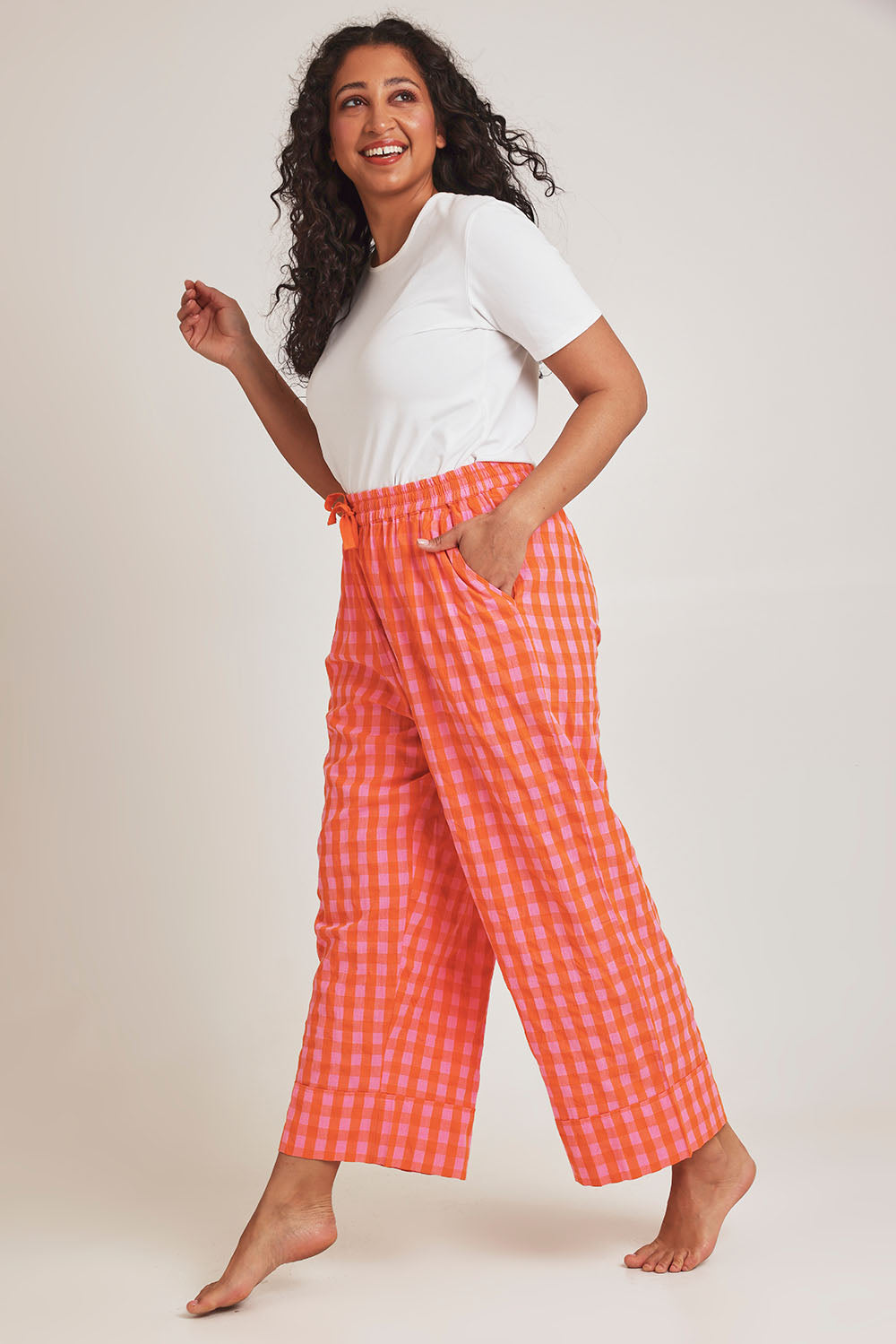 Model Terri-Leigh wearing the Cotton Check Pyjama Pants in colour Bright (Pink), from the front, showing the whole outfit
