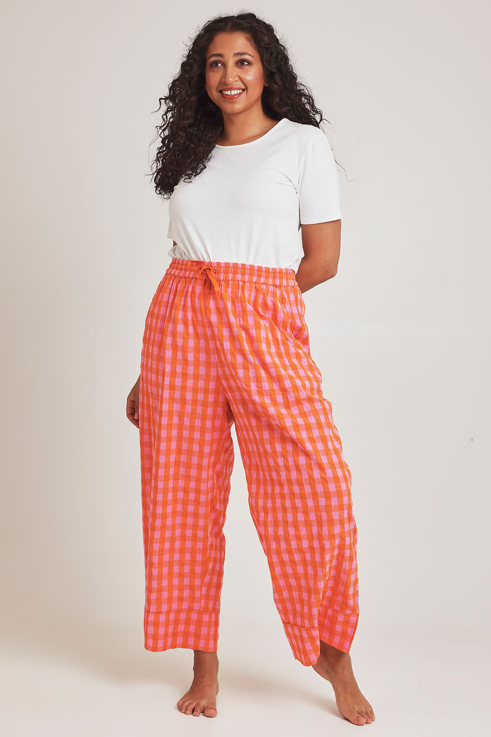 Model Terri-Leigh wearing the Cotton Check Pyjama Pants in colour Bright (Pink), from the front, showing the whole outfit