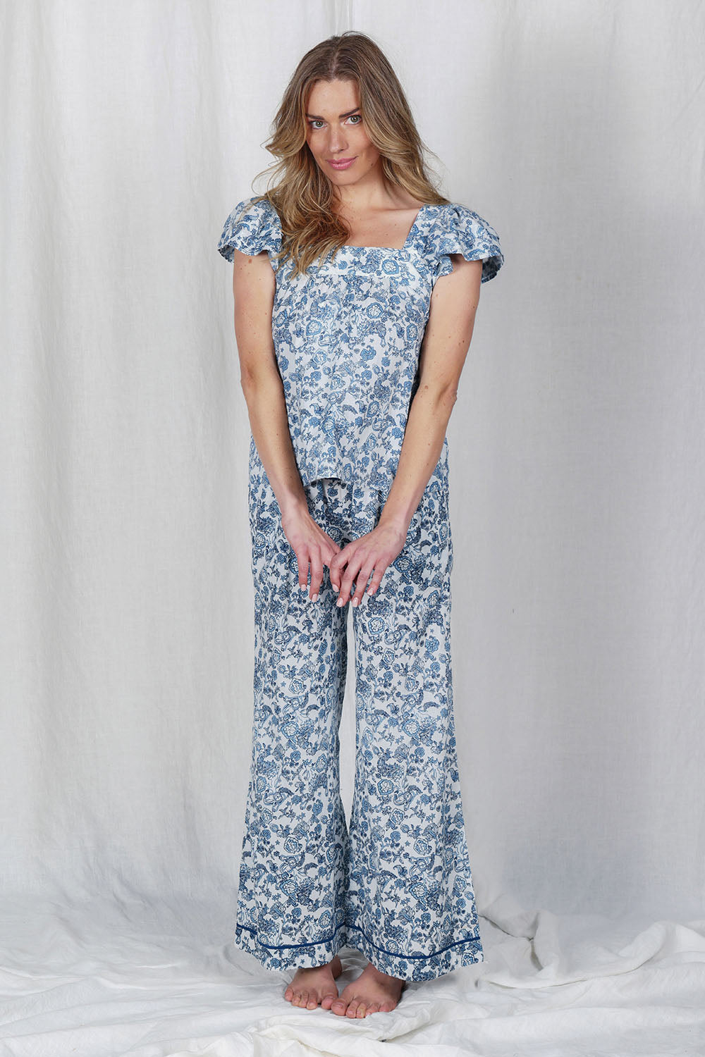 Model Olivia wearing the Cotton Frill Cami Sleep Set in colour Paisley (Blue), from the front, showing the whole outfit