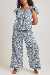 Model Terri-Leigh wearing the Cotton Frill Cami Sleep Set in colour Paisley (Blue), from the front, cropped image