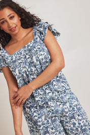 Model Terri-Leigh wearing the Cotton Frill Cami Sleep Set in colour Paisley (Blue), from the front, cropped image