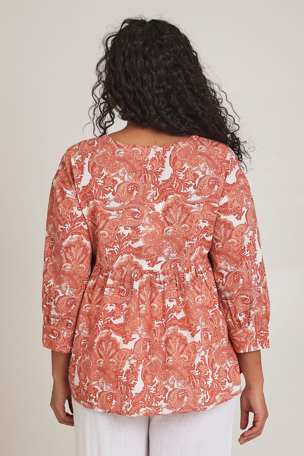 Model Terri-Leigh wearing the Cotton Tie Front Top in colour Paisley (Pink), from the back
