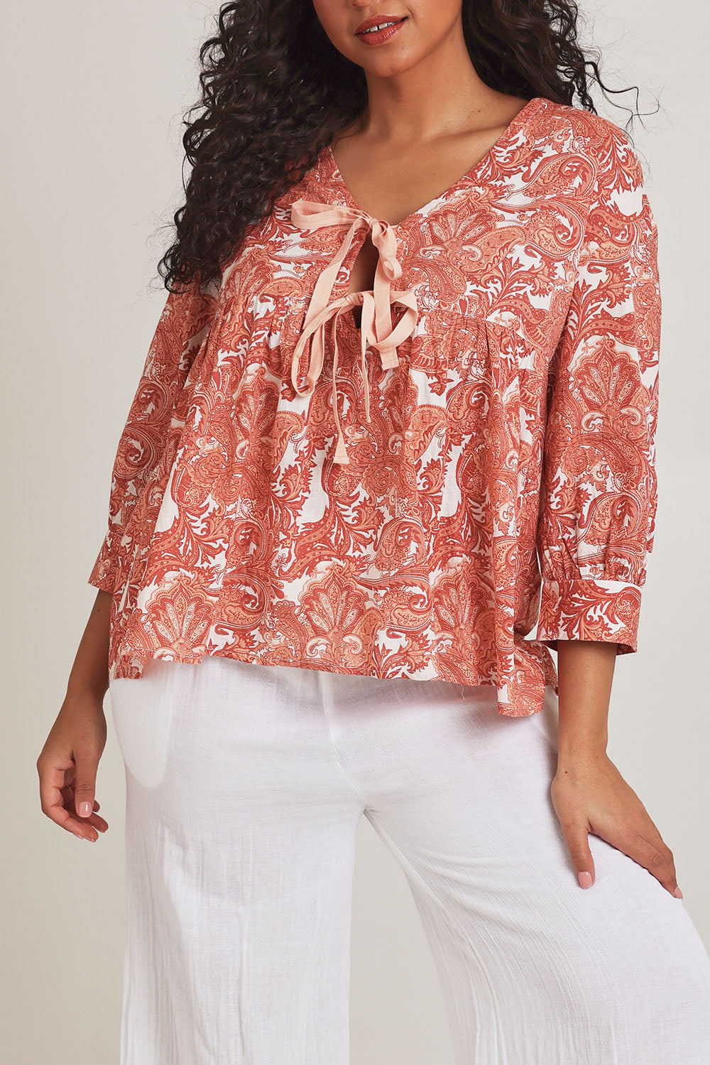 Model Terri-Leigh wearing the Cotton Tie Front Top in colour Paisley (Pink), from the front, cropped image