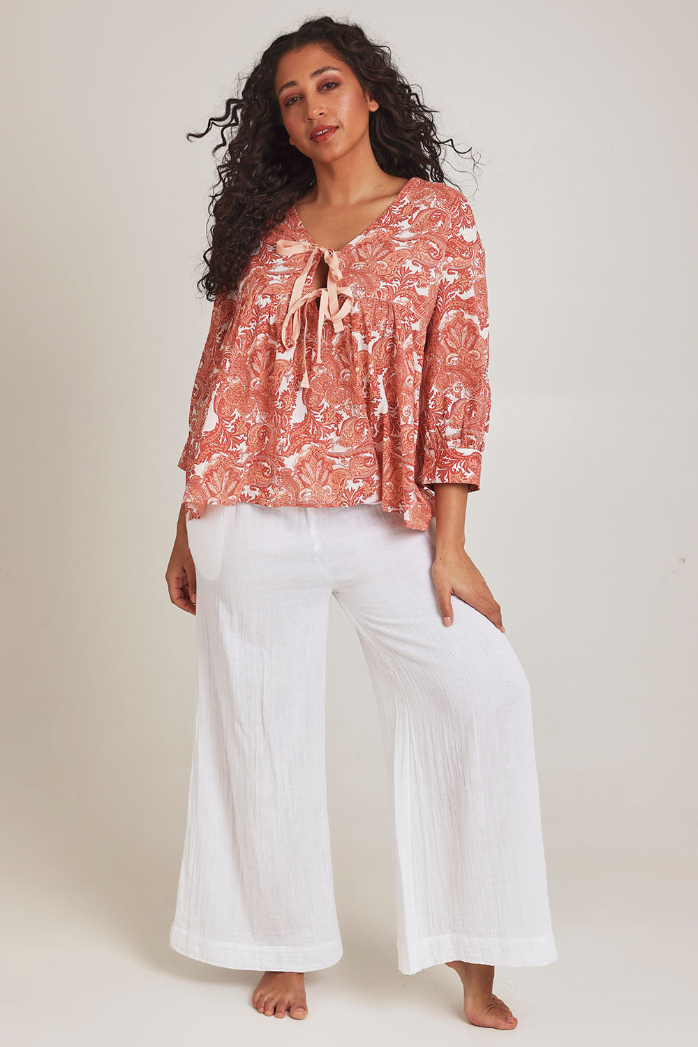 Model Terri-Leigh wearing the Cotton Tie Front Top in colour Paisley (Pink), from the front, showing the whole outfit