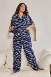 Model Tahneei wearing size 10 of the Viscose Twill Pyjama Top – Navyspot in colour Navyspot, from the front