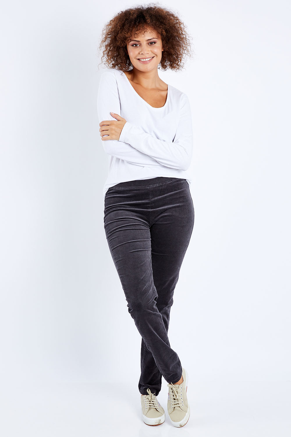 Model Lala wearing size 10 of the Skinny Leg Cord Pull On Pant in colour Charcoal (Grey), from the front, showing the whole outfit