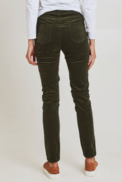 Model Madeline wearing size 10 of the Skinny Leg Cord Pull On Pant in colour Deepsage (Green), from the back