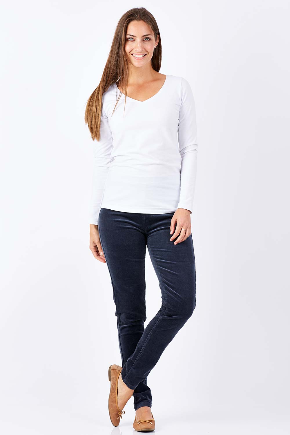 Model Anna wearing size 10 of the Skinny Leg Cord Pull On Pant in colour Graphite (Black), from the front, showing the whole outfit