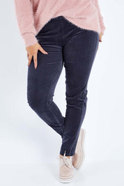 Model Sasha-Lee wearing size 16 of the Skinny Leg Cord Pull On Pant in colour Graphite (Black), from the front, cropped image