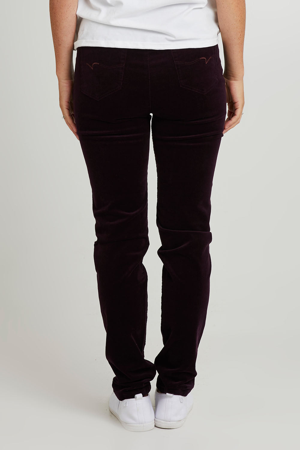 Model Katie wearing size 10 of the Skinny Leg Cord Pull On Pant in colour Mulberry (Purple), from the back