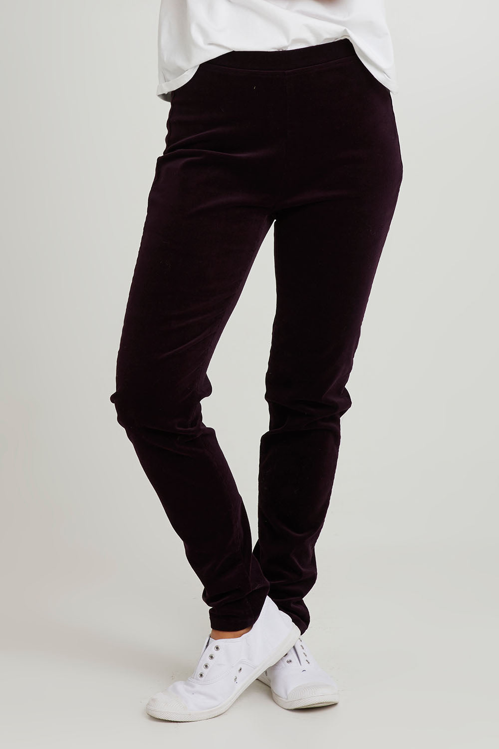 Model Katie wearing size 10 of the Skinny Leg Cord Pull On Pant in colour Mulberry (Purple), from the front, cropped image