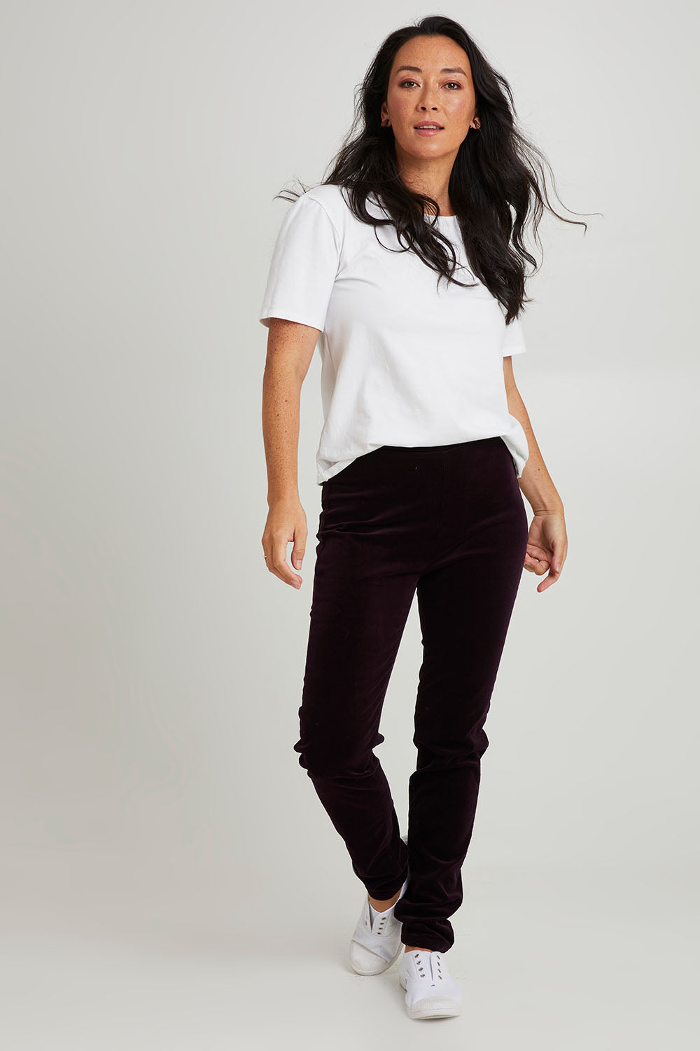 Model Katie wearing size 10 of the Skinny Leg Cord Pull On Pant in colour Mulberry (Purple), from the front, showing the whole outfit