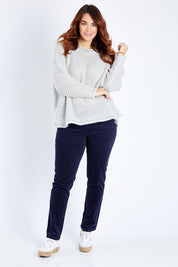 Model Laura wearing size 12 of the Skinny Leg Cord Pull On Pant in colour Navy (Blue), from the front, showing the whole outfit