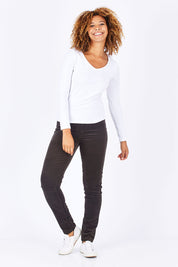 Model Summer wearing size 10 of the Skinny Leg Cord Pull On Pant in colour Walnut, from the front, showing the whole outfit