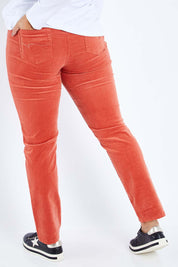 Model Sasha-Lee wearing size 16 of the Pin Cord Slim Pant in colour Auburn, from the back