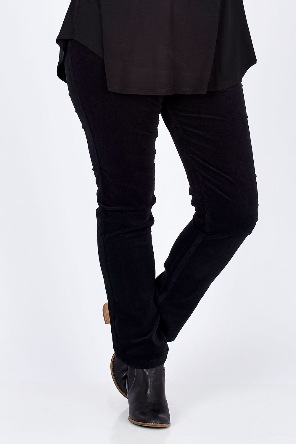 Model Jess wearing size 14 of the Pin Cord Slim Pant in colour Black (Black), from the front, cropped image