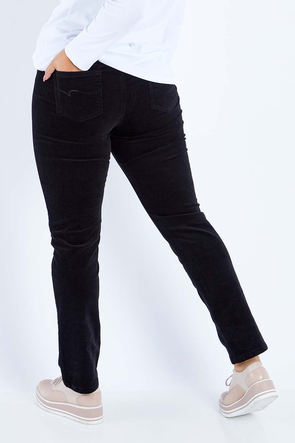 Model Sasha-Lee wearing size 16 of the Pin Cord Slim Pant in colour Black (Black), from the back