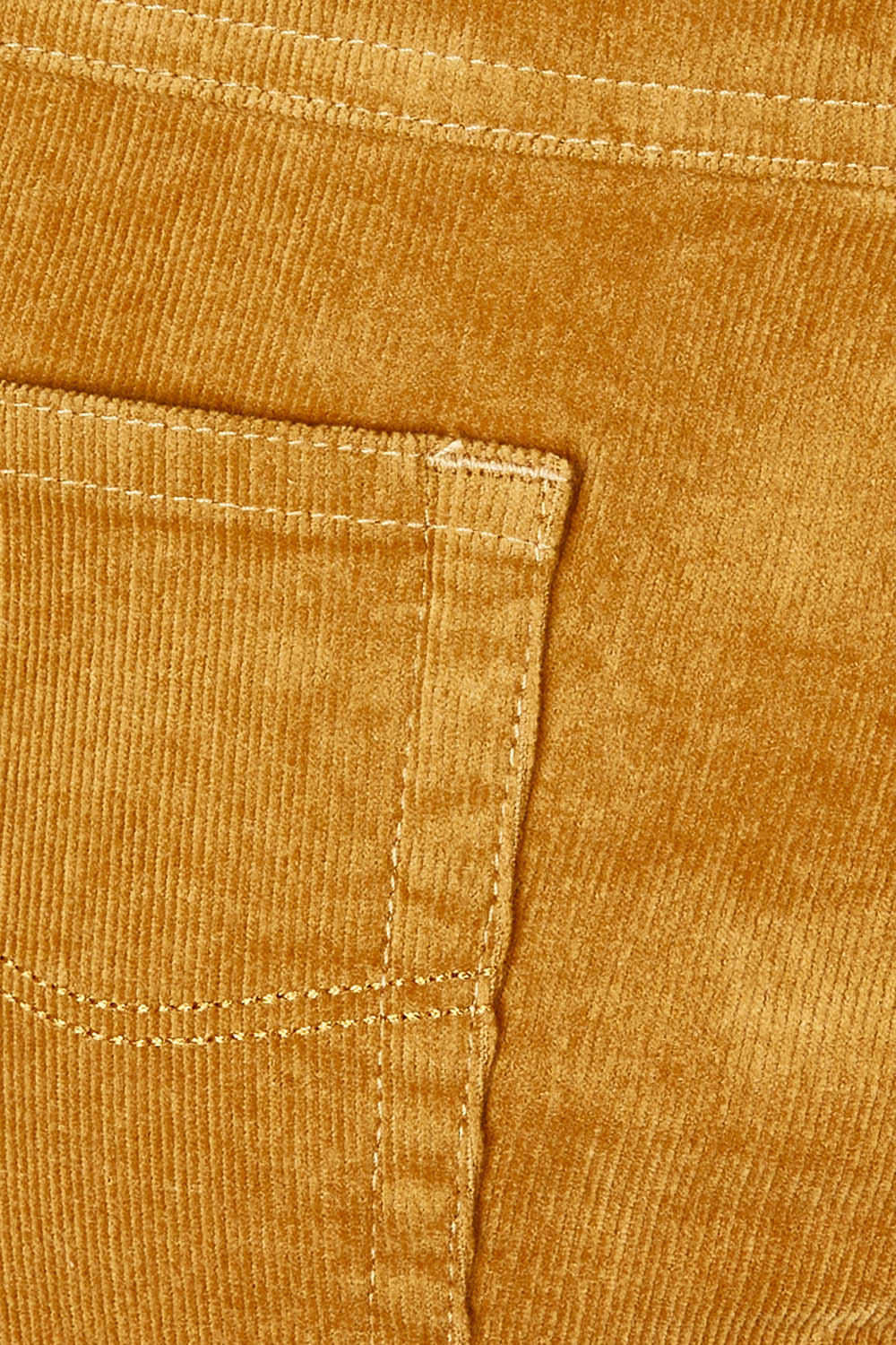 Product shot of the Pin Cord Slim Pant in colour Mustard, detail