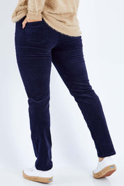 Model Sasha-Lee wearing size 16 of the Pin Cord Slim Pant in colour Navy (Blue), from the back