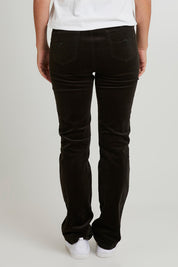 Model Katie wearing size 10 of the Pin Cord Slim Pant in colour Olive (Green), from the back