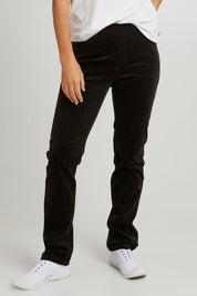 Model Katie wearing size 10 of the Pin Cord Slim Pant in colour Olive (Green), from the front, cropped image