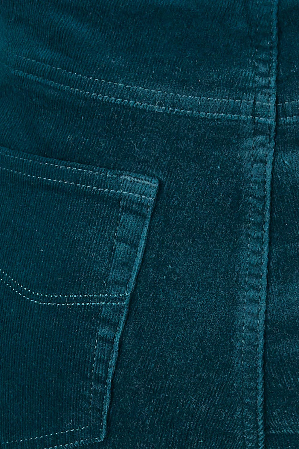 Product shot of the Pin Cord Slim Pant in colour Peacock (Green), detail