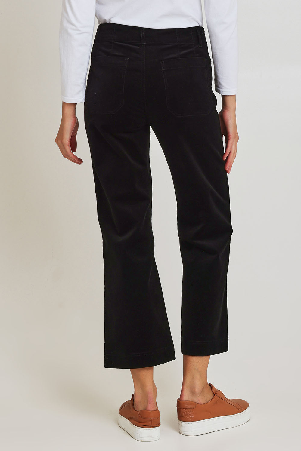 Model Madeline wearing size 10 of the Wide Leg Ankle Grazer Pant in colour Black (Black), from the back