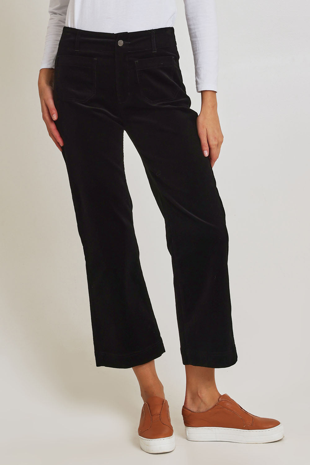 Model Madeline wearing size 10 of the Wide Leg Ankle Grazer Pant in colour Black (Black), from the front, cropped image