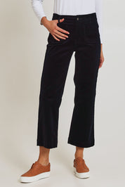 Model Madeline wearing size 10 of the Wide Leg Ankle Grazer Pant in colour Midnight (Blue), from the front, cropped image