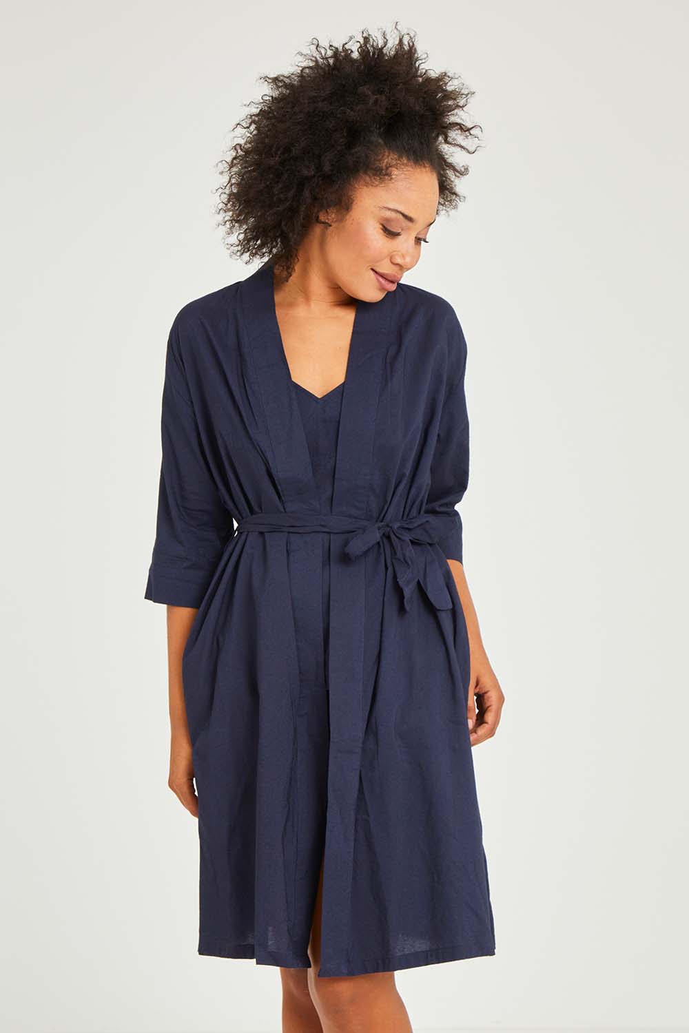Model Olivia wearing size S of the Bamboo Cotton Kimono Robe in colour Navy (Blue), from the front, cropped image