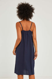 Model Olivia wearing size S of the Bamboo Cotton Strappy Nightie in colour Navy (Blue), from the back
