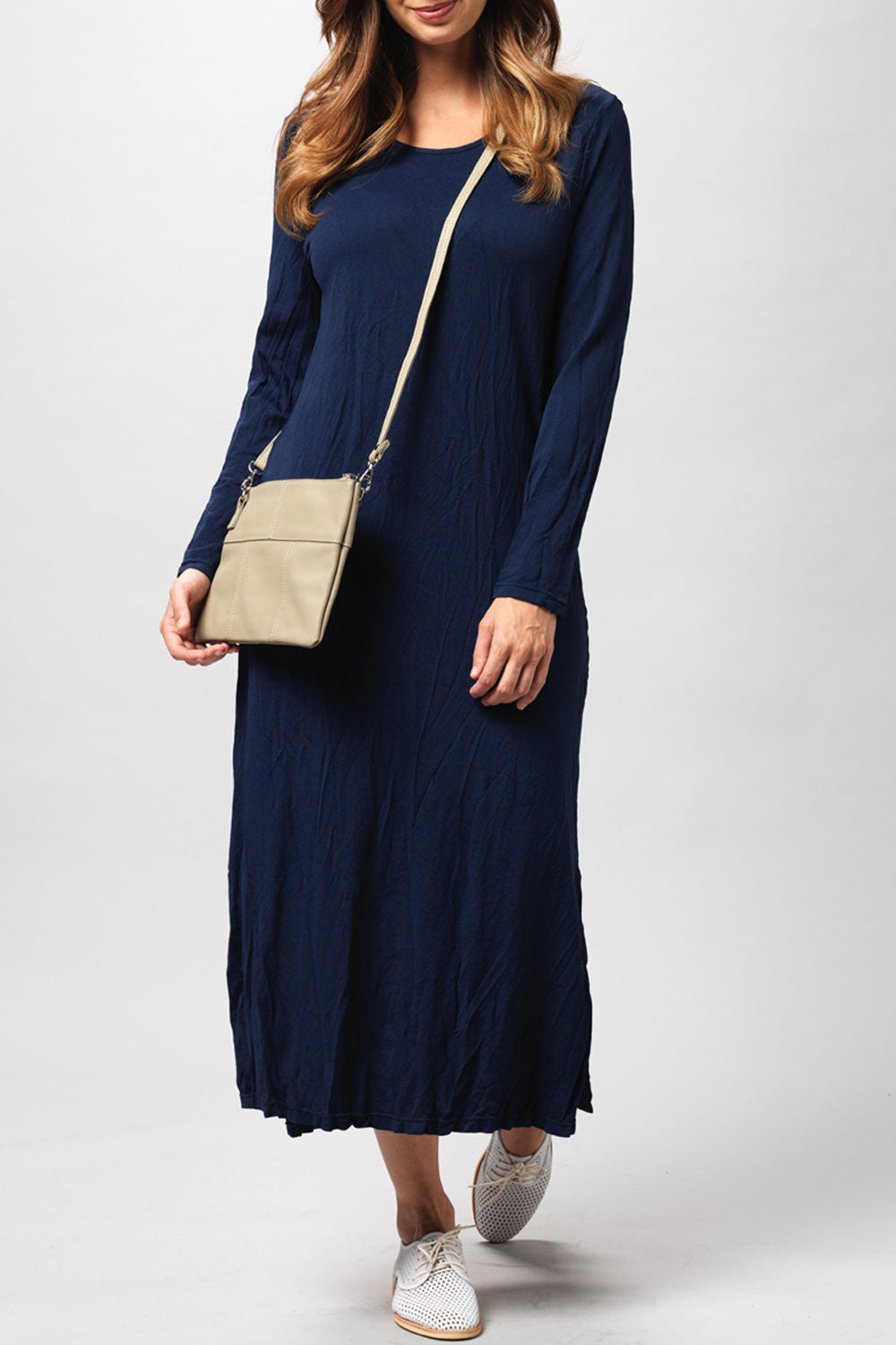 A model wearing the Long Sleeve Maxi in colour Navy (Blue), from the front, cropped image