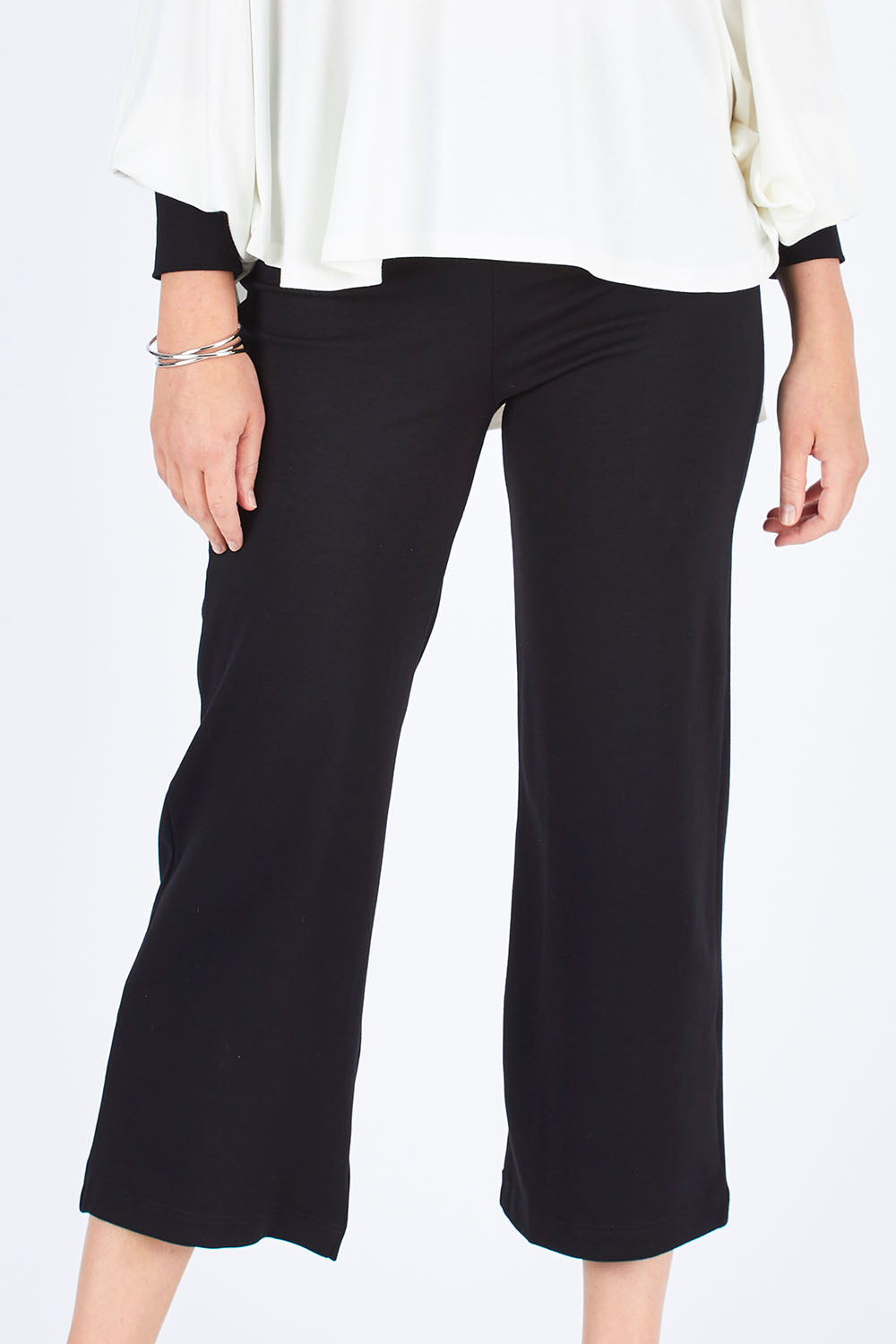 Model Chelsea wearing size S of the Wide Leg Ponte Pant in colour Black (Black), from the front, cropped image