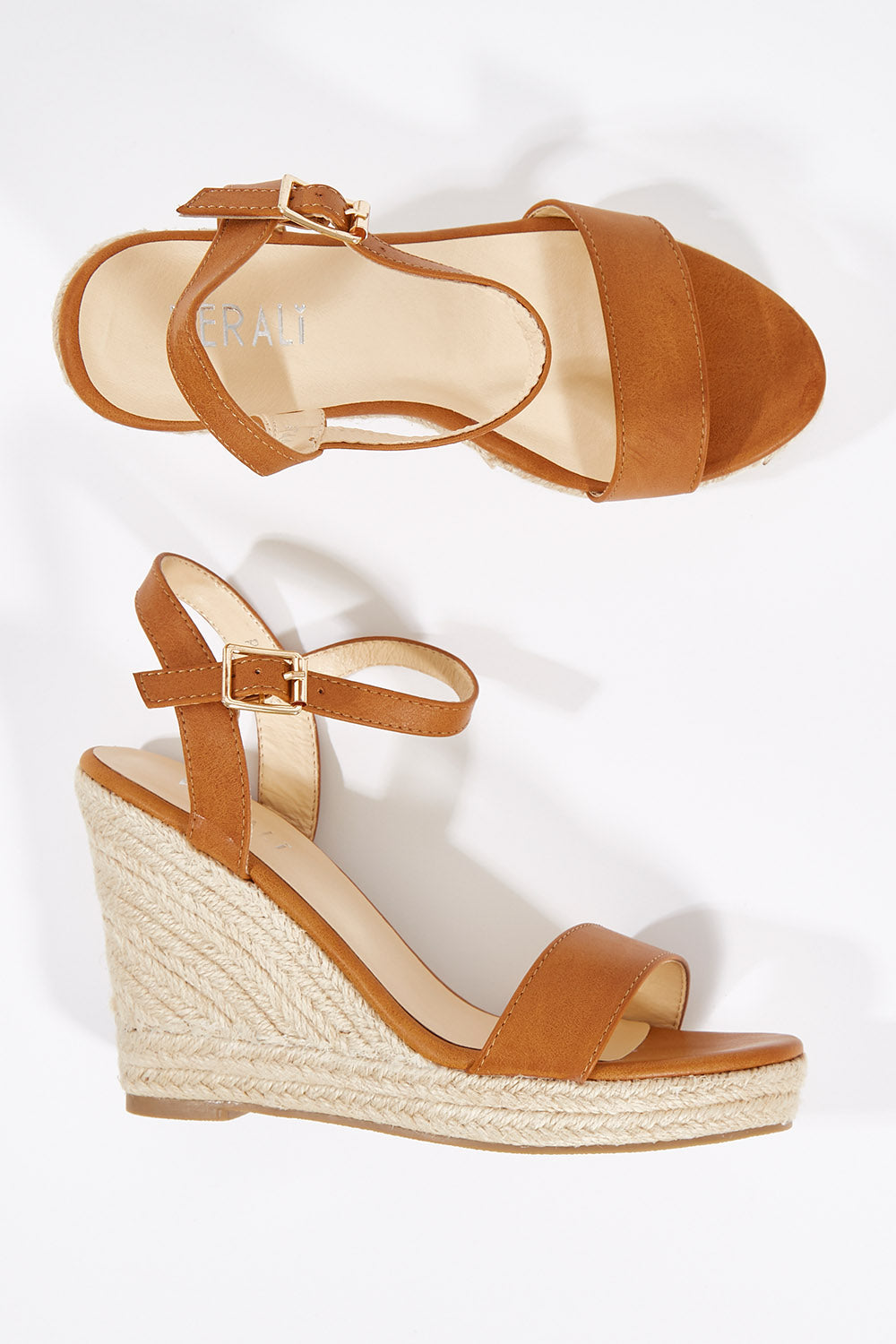 A model wearing size 36 of the Amaya Wedge Heel in colour Tan, from the front, showing the whole outfit