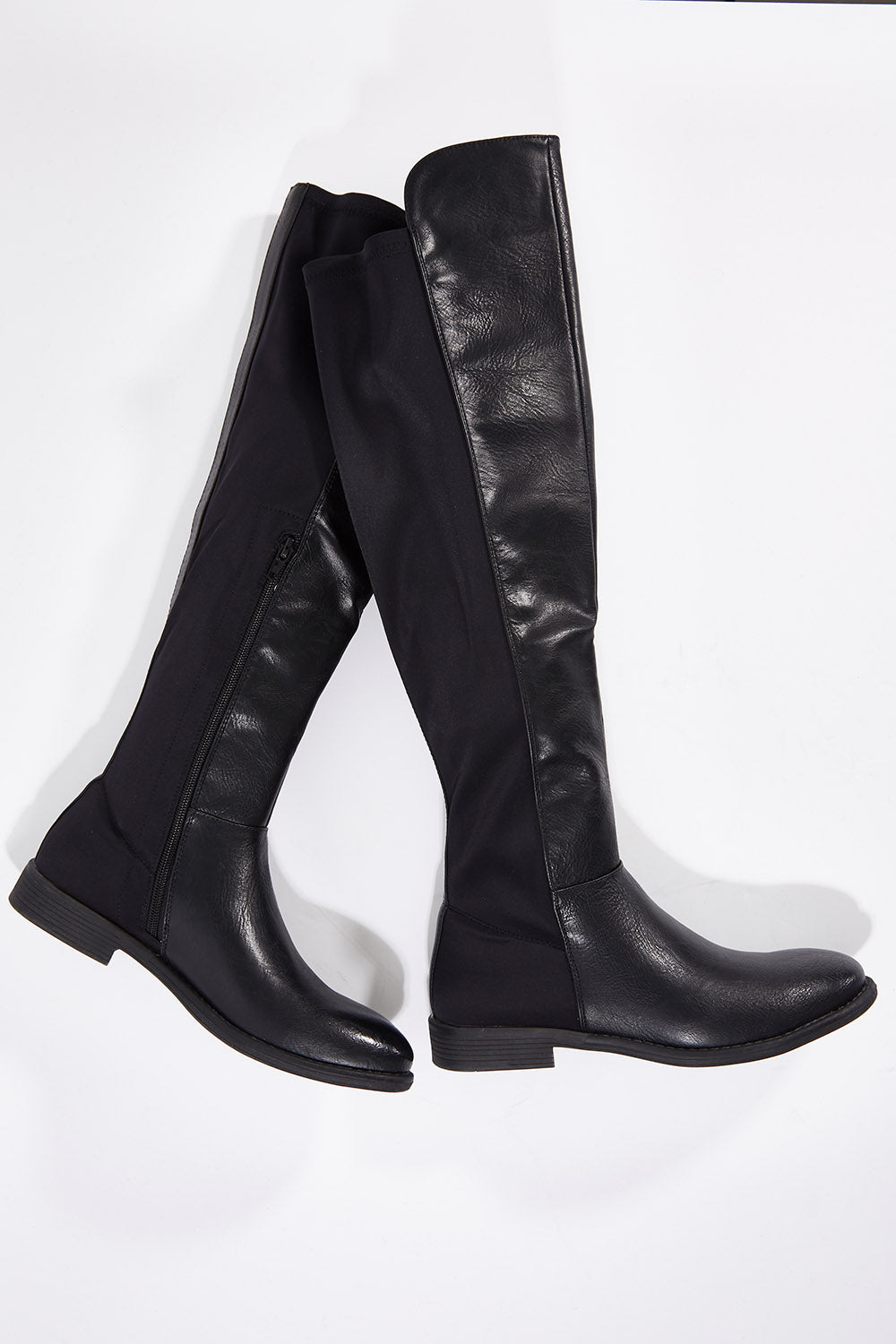 A model wearing size 36 of the Elenor Boot in colour Black (Black), from the front, showing the whole outfit