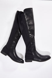 A model wearing size 36 of the Elenor Boot in colour Black (Black), from the front, showing the whole outfit